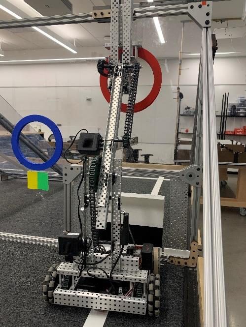 The competition robot at the ramp with its four-bar lift raised
